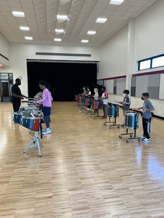Black Star Drum League playing drums in the Madison Youth Arts center