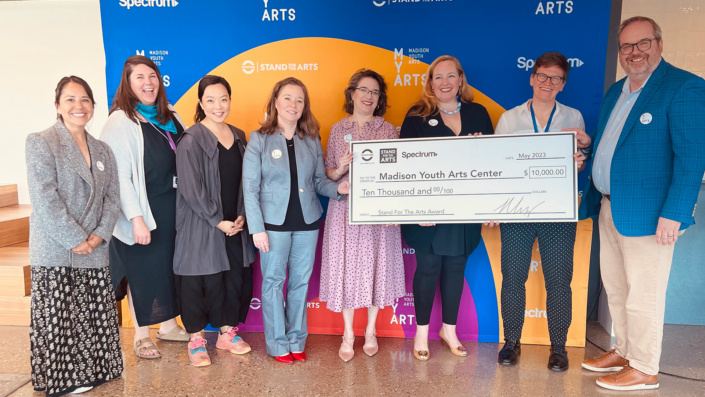 MYArts receiving a $10,000 check from the Stand For The Arts Award